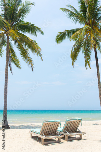 Beach chairs on the white sand beach