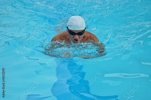 Elderly swimming is a healthy exercise that maintains health. © ATIPPORN