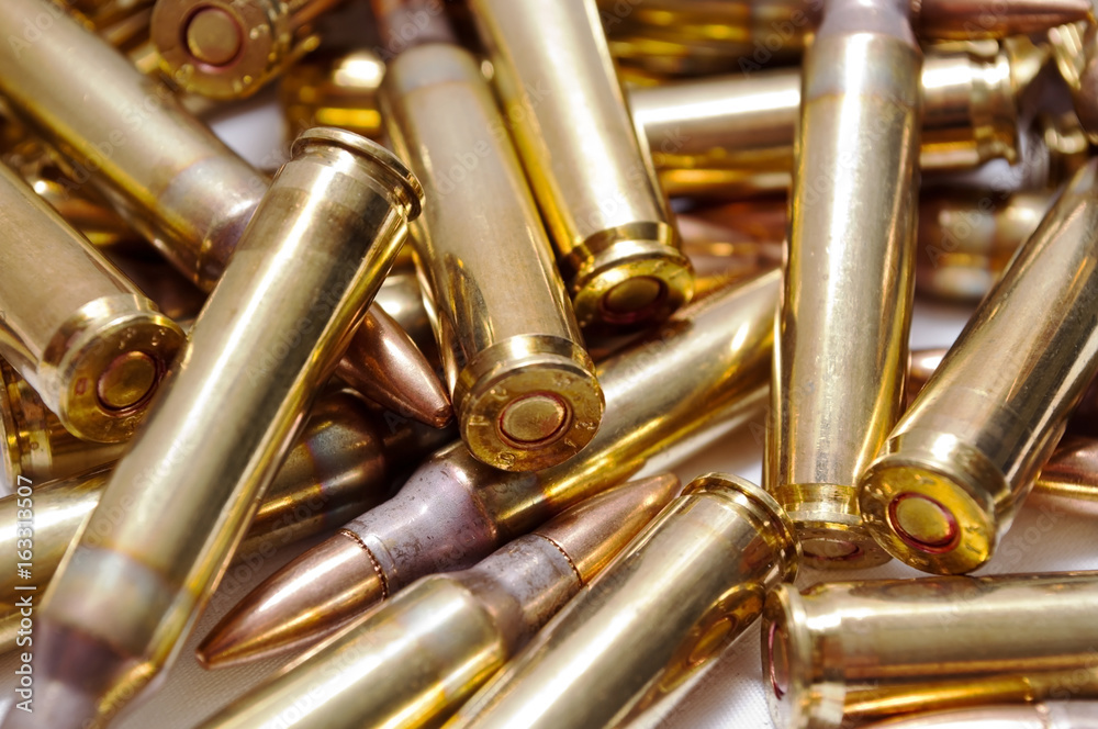 Naklejka premium A close up of loaded 223 brass ammo 