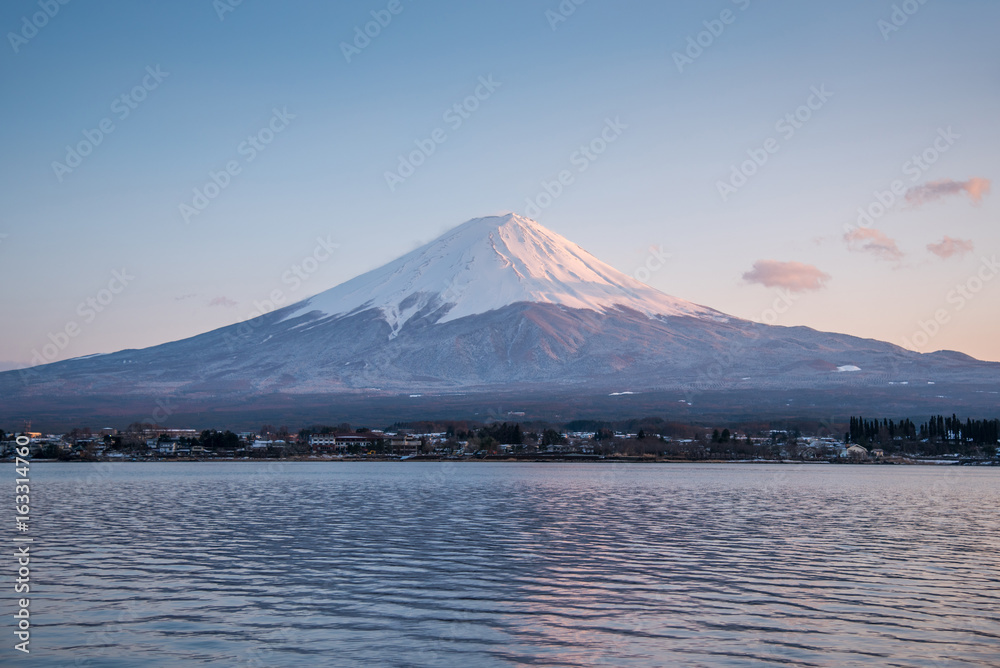 scenic landscape of Fuji mountain (Fujisan) in spring season, beautiful snowcapped volcano and famous natural landmark of Japan, view from Kawaguchi lake in Yamanashi Prefecture, Japan