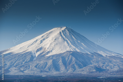 Fuji mountain (Fujisan), beautiful snowcapped volcano and famous natural landmark of Japan, view from Kawaguchiko lake in Yamanashi Prefecture, Japan © zephyr_p