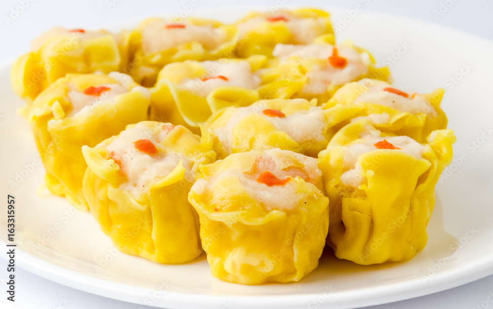 Chinese steamed shrimp dumplings on white dish Chinese steamed shrimp dumplings on white dish