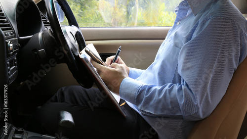 Business man in a car.