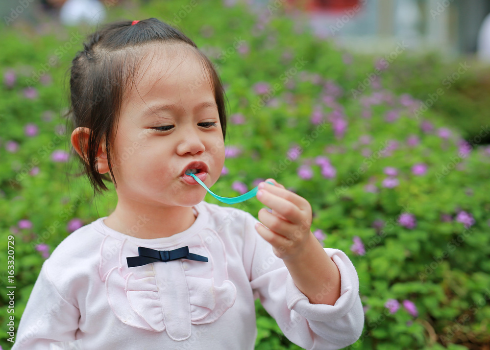 Cute little girl enjoy eating bubble gum. Cute little girl enjoy eating bubble gum.