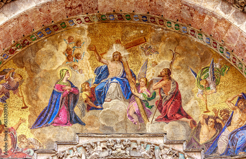 Mosaic of Jesus and his cross from the outside of San Marco Cathedral in Venice, Italy