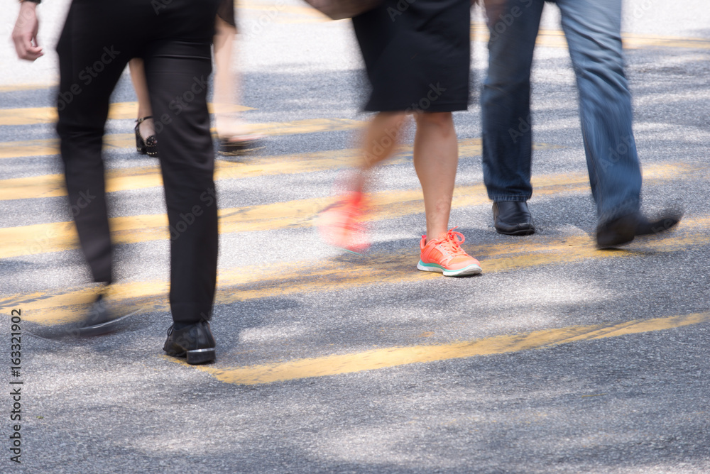 Motion Blur - People crossing the road. Blurry effect to illustrate movement Motion Blur - People crossing the road. Blurry effect to illustrate movement