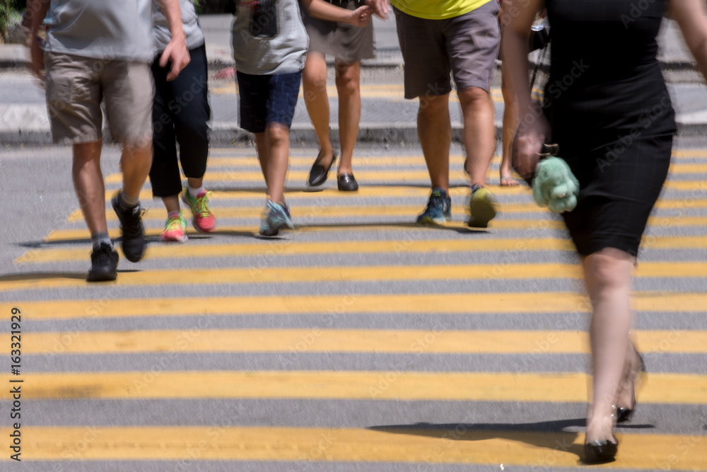 Motion Blur - People crossing the road. Blurry effect to illustrate movement Motion Blur - People crossing the road. Blurry effect to illustrate movement