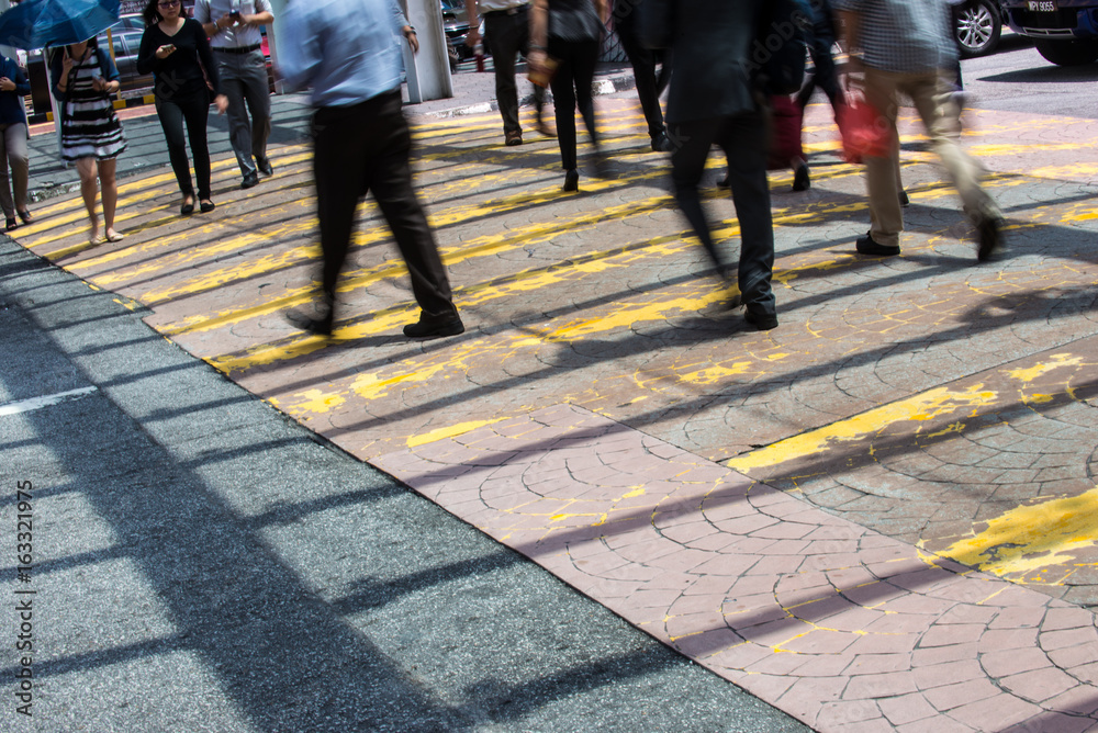 Motion Blur - People crossing the road. Blurry effect to illustrate movement Motion Blur - People crossing the road. Blurry effect to illustrate movement