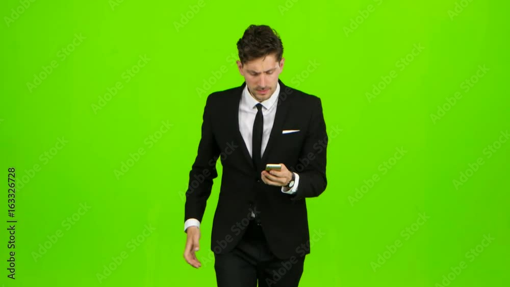 Businessman is ringing the phone, he is late and starts running. Green screen Businessman is ringing the phone, he is late and starts running. Green screen