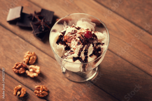 Ice cream sundae, chocolate pieces, walnuts and anise
