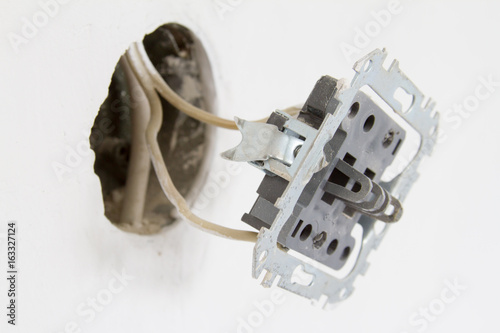 Foto Installation of electrical contacts on the white wall