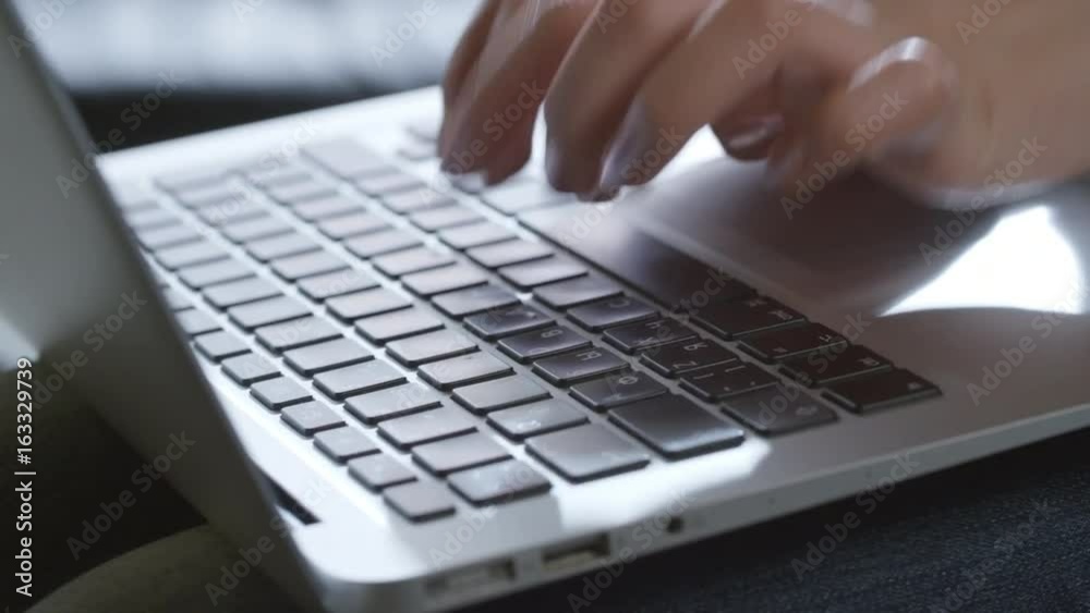 PAN with close up of hands of businesswoman typing on laptop PAN with close up of hands of businesswoman typing on laptop
