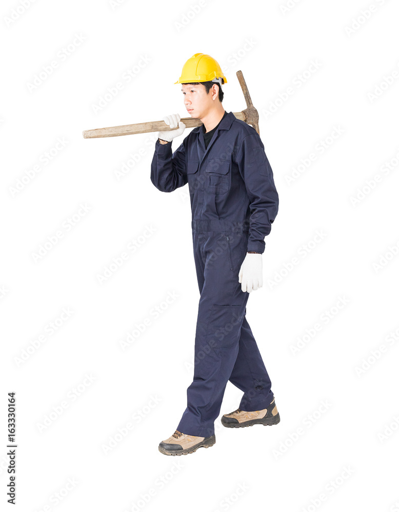Man in uniform hold old pick mattock that is a mining device Man in uniform hold old pick mattock that is a mining device