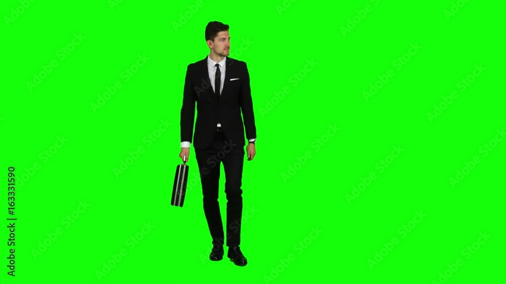 Man is going to a negotiation, he has a diplomat in his hands. Green screen Man is going to a negotiation, he has a diplomat in his hands. Green screen