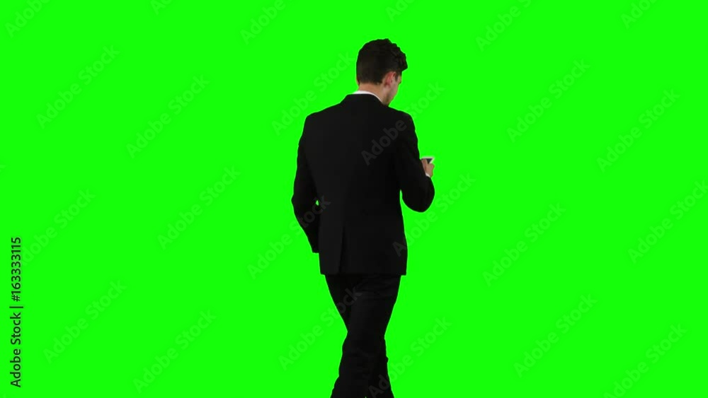 Businessman is going to work and prints important messages. Green screen Businessman is going to work and prints important messages. Green screen