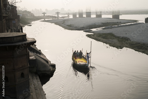 Pilgrims taking a boat ride on holy Yamuna river, Vrindavan.