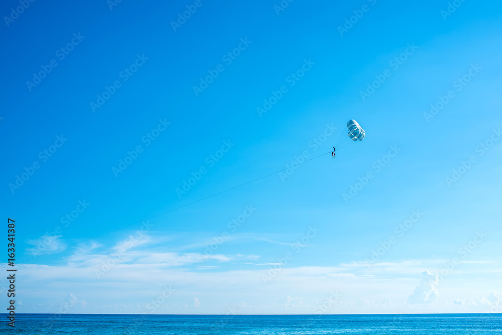 Flying parasailing in a blue sky,Phuket,Thailand.