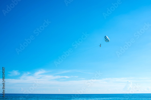 Flying parasailing in a blue sky,Phuket,Thailand.