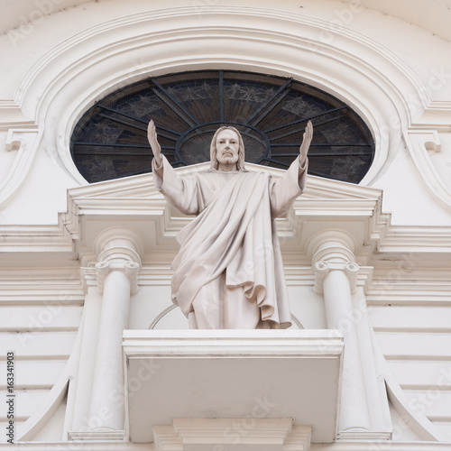 Sculpture of Jesus Christ called 'Salvador del mundo' on the outside of the National Cathedral at the Gerardo Barrios Square in downtown San Salvador, El Salvador. photo