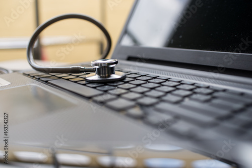 Stethoscope on computer notebook