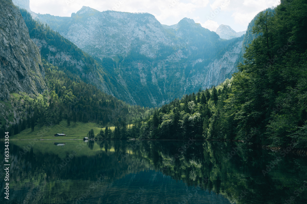 Mountain lake in south Germany with forest and reflection Mountain lake in south Germany with forest and reflection