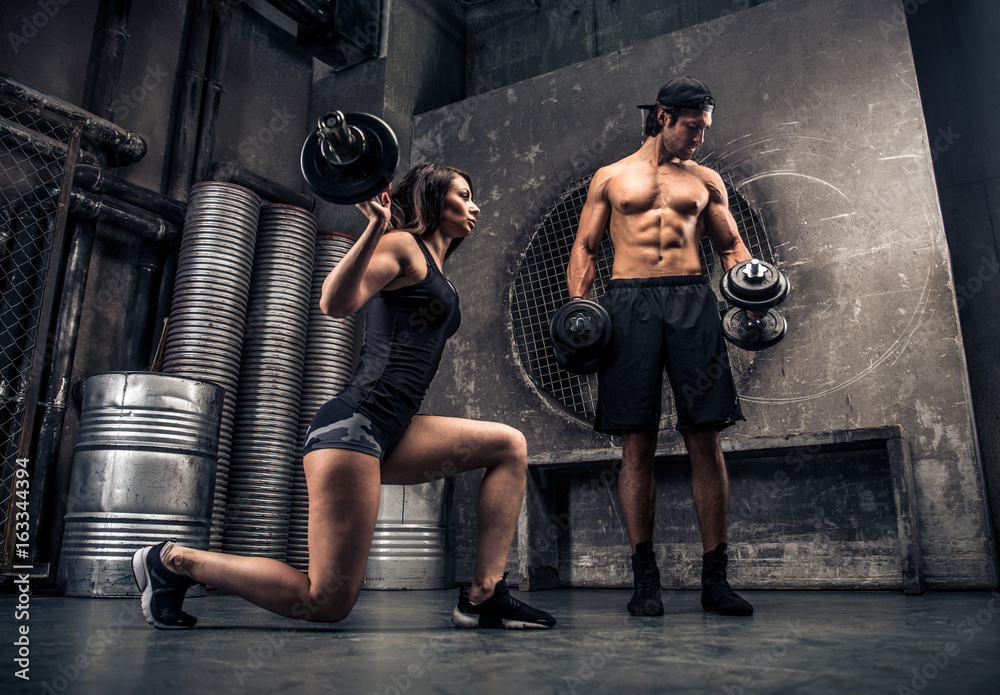Couple training in a gym Stock Photo | Adobe Stock