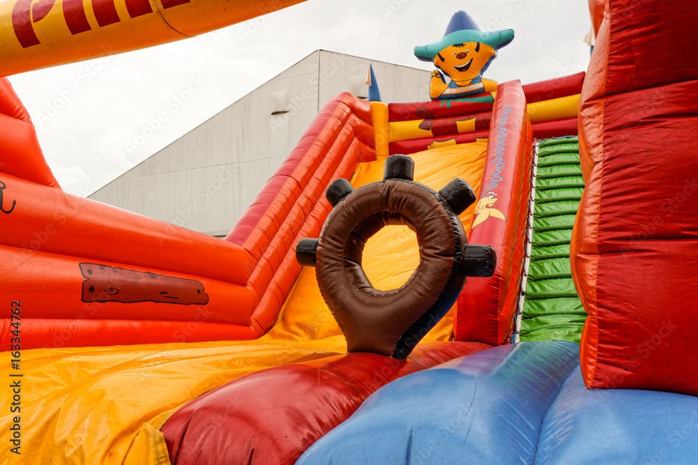 Inflatable, colorful pirate boat in playground