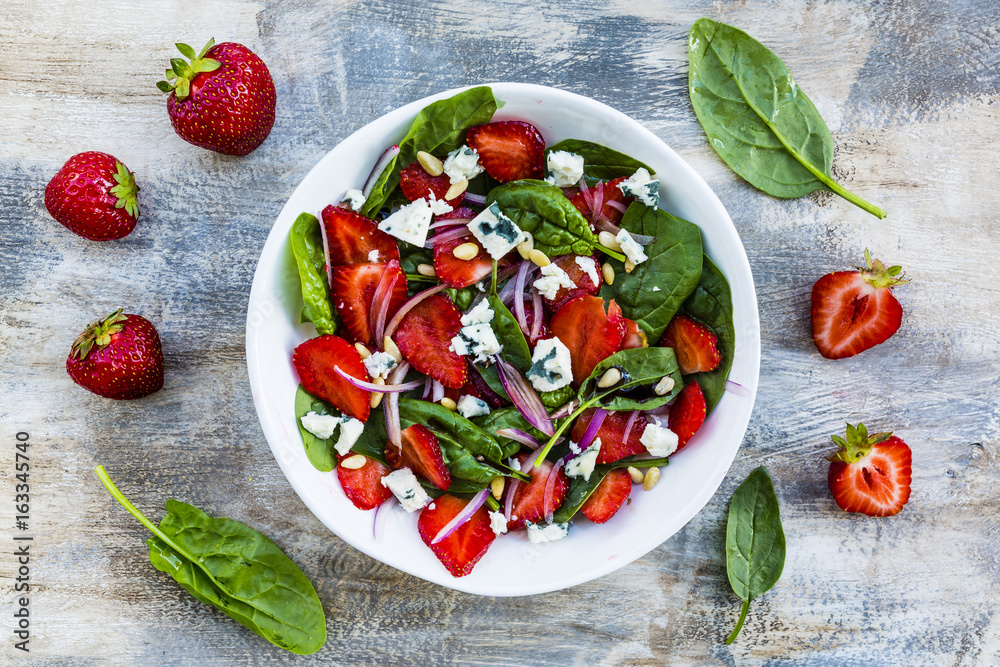 Delicious and healthy strawberry salad and spinach with blue cheese. Delicious and healthy strawberry salad and spinach with blue cheese.