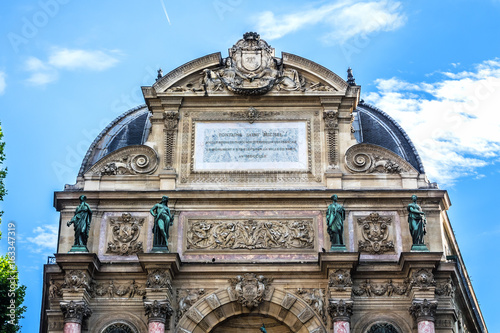 Fragment of a baroque fountain Saint-Michel (architect Gabriel Davioud, 1858 - 1860). Fountain Saint-Michel - popular architectural historical landmark. Latin Quarter, Paris, France. photo