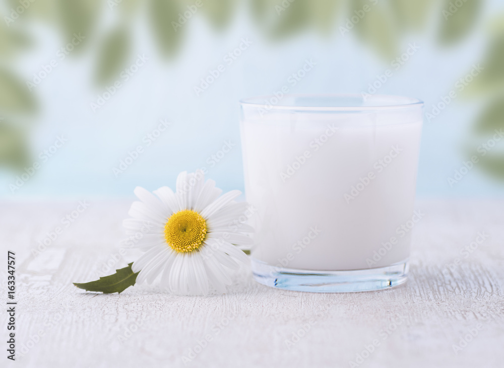 Glass of milk on a wooden table. Glass of milk on a wooden table.