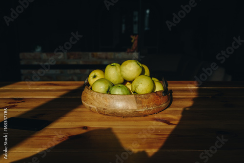 Fototapeta Naklejka Na Ścianę i Meble -  Healthy green food with apples on wood plates desk background mock up