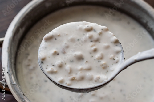 Cold Yogurt Soup with wheat in the ladle