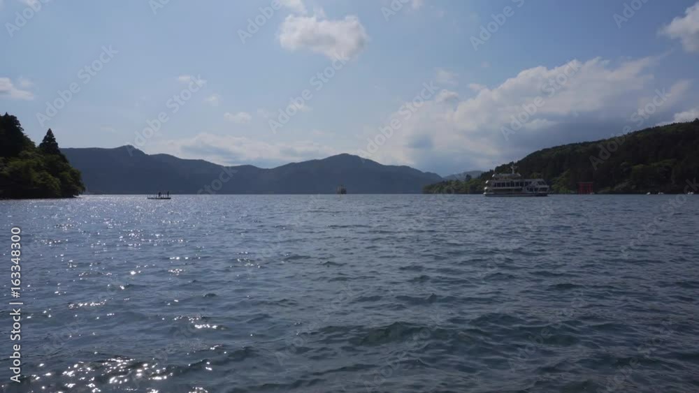 Tourist boats and Hakone shrine red gate at lake Ashi in Hakone, Kanagawa Prefecture, Japan Tourist boats and Hakone shrine red gate at lake Ashi in Hakone, Kanagawa Prefecture, Japan