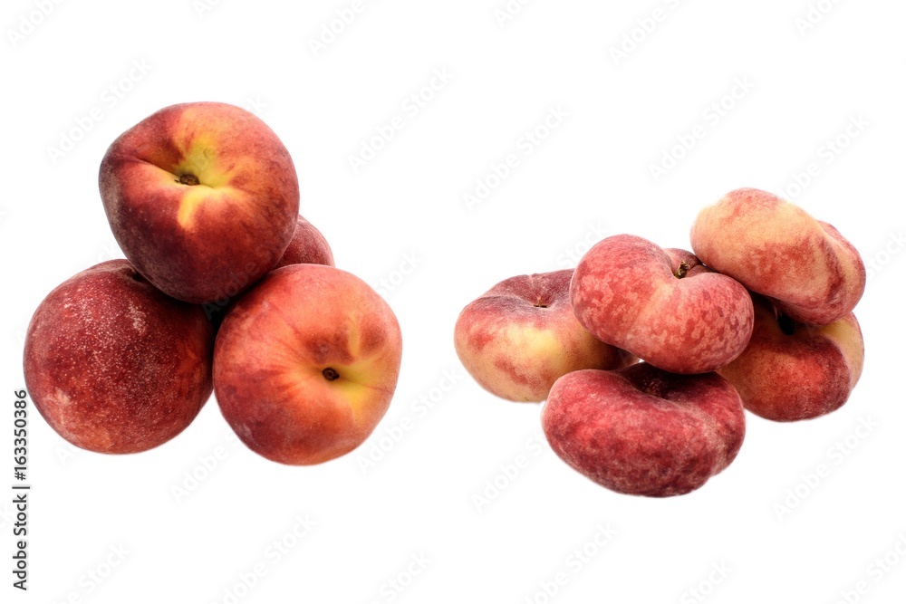 Ripe sweet flat peaches and round peaches isolated on white background Ripe sweet flat peaches and round peaches isolated on white background