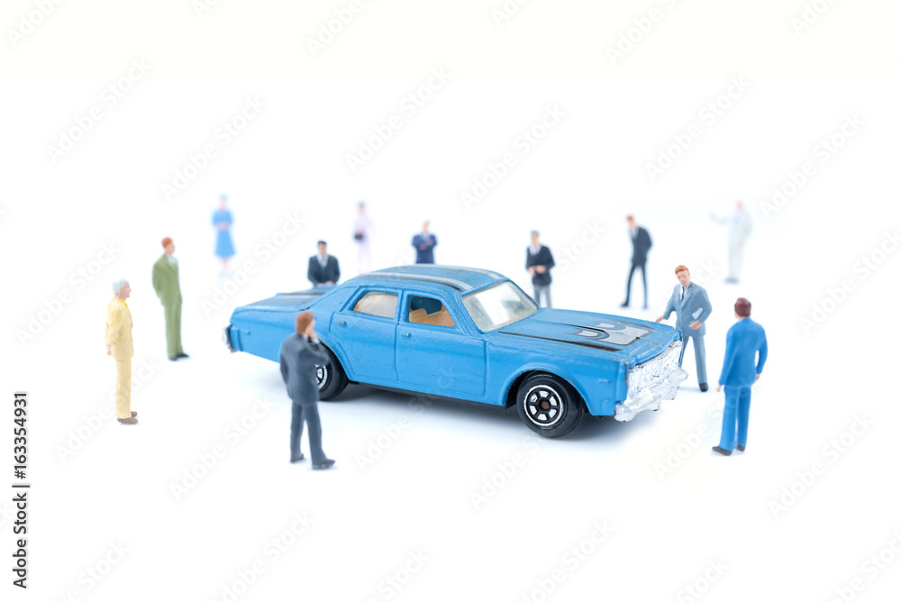 Miniature business people with car dealer in cars exhibition show Miniature business people with car dealer in cars exhibition show