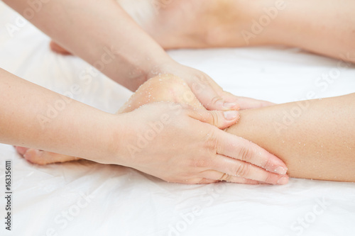 Woman Getting a Salt Scrub Beauty Treatment in the Health Spa