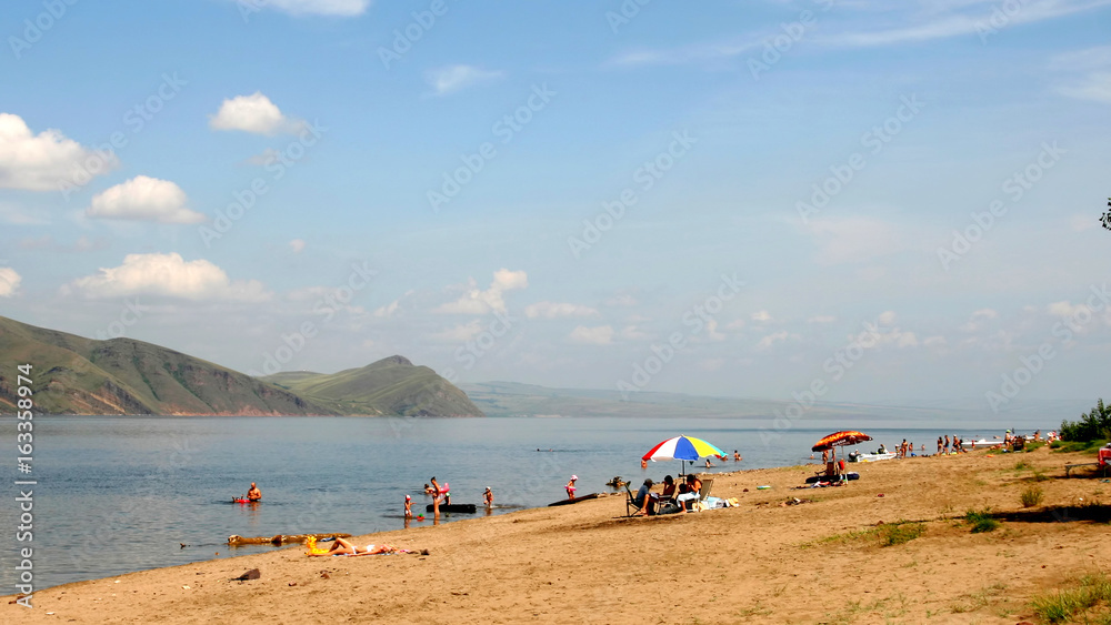 Fototapeta premium Relax on the sandy shore.