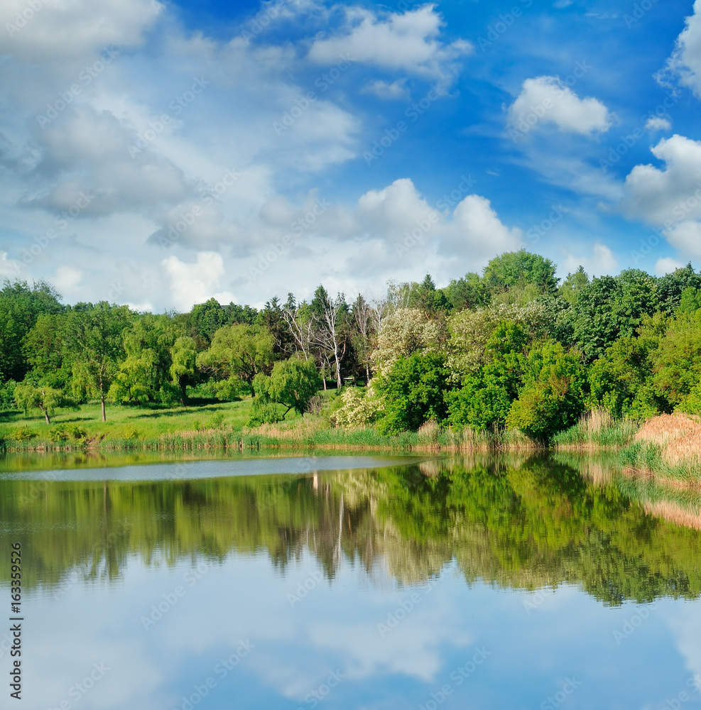 picturesque lake, forest on the banks and sky picturesque lake, forest on the banks and sky