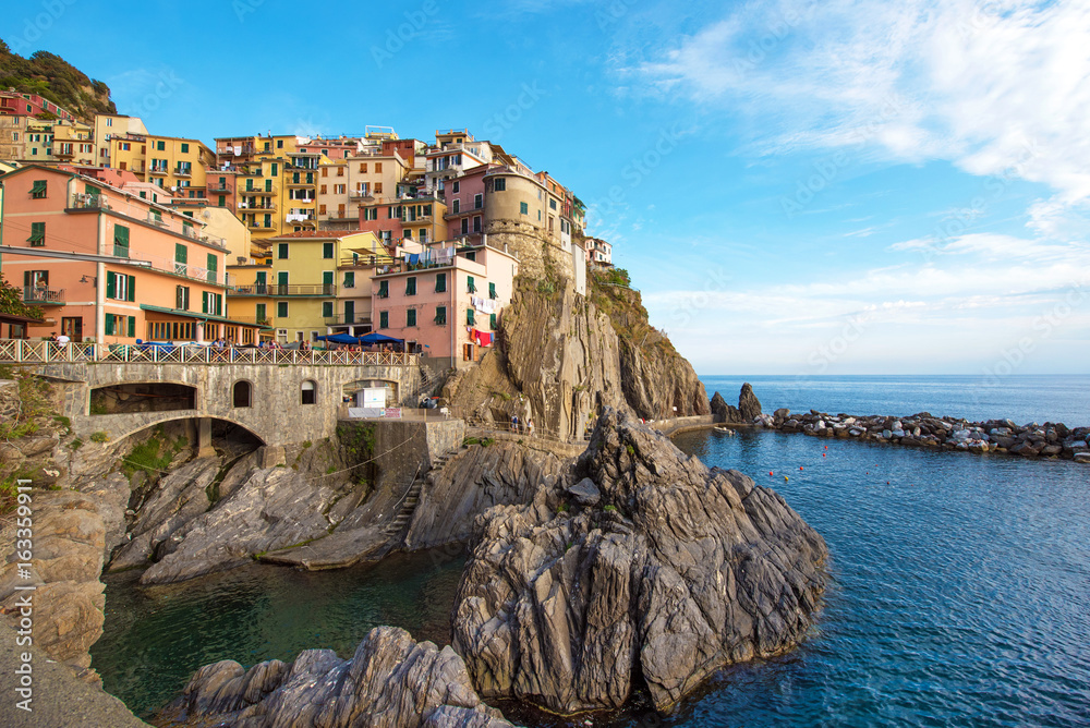 Beautiful colorful summer landscape on the coast of Manarola in Cinque Terre, Liguria, Italy, Europe