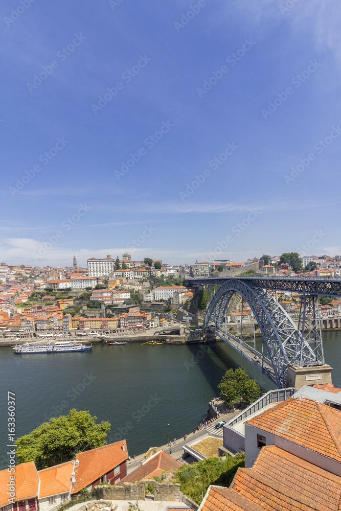 View of Ribeira historical quarter, on the margin Douro river embankment Oporto old town and Luis I bridge, Porto.