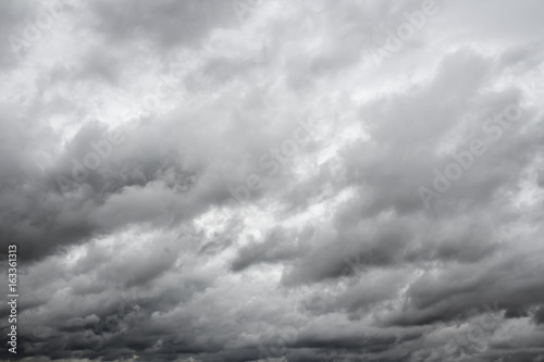 Dramatic overcast cloudy sky. Clouds flying over horizon, cloudscape.