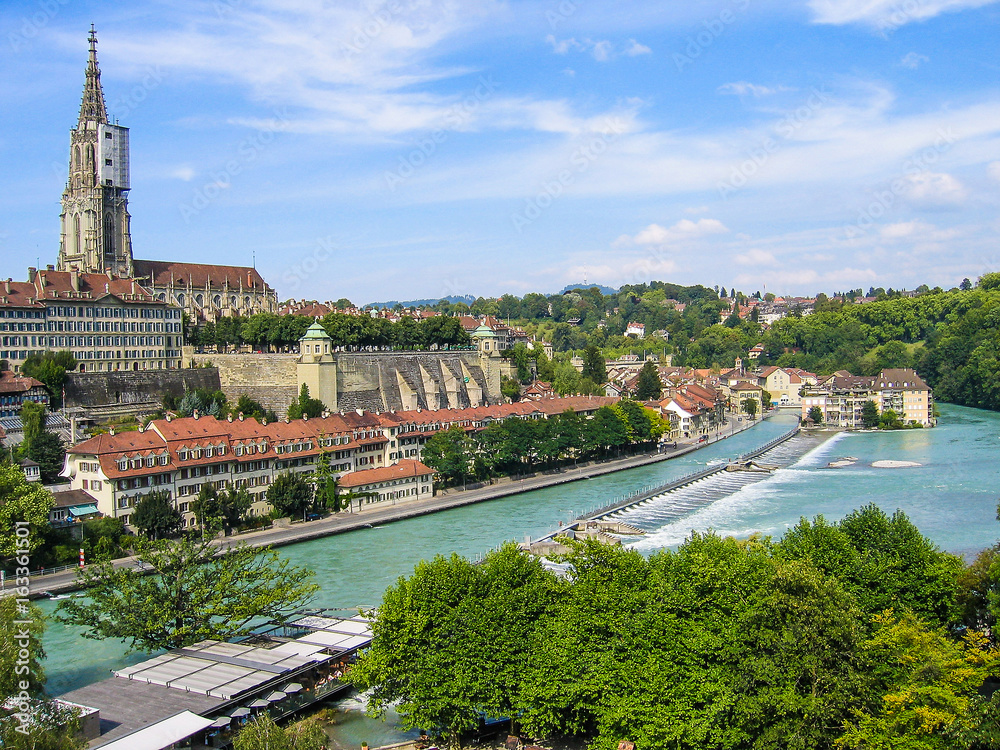Bern downtown city aerial cityscape or skyline with light green river during summer with old buildings