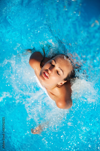 Beautiful woman in a swimming pool