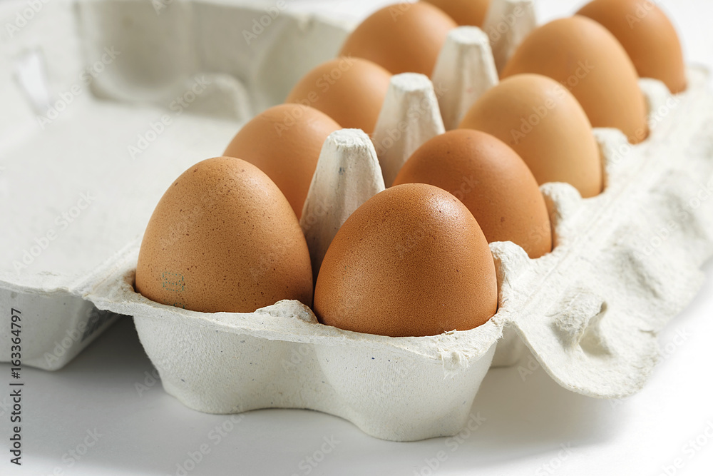 Raw eggs closeup, soft focus. Eggs in the box Raw eggs closeup, soft focus. Eggs in the box
