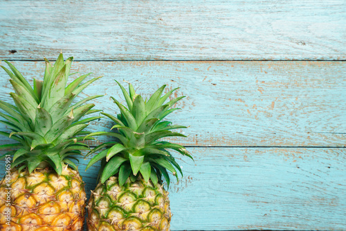 pineapple on the blue wood texture background. copy space