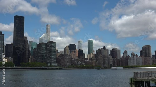 Viewing beautiful breathtaking Manhattan Skyline from Long Island City in New York, wide shot panorama with ONU,United Nations Headquarters,Ultra Hd 4k, real time