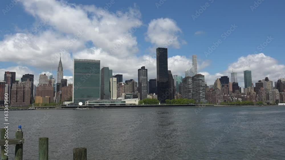 Viewing beautiful breathtaking Manhattan Skyline from Long Island City in New York, wide shot panorama with ONU,United Nations Headquarters,Ultra Hd 4k, real time Viewing beautiful breathtaking Manhattan Skyline from Long Island City in New York, wide shot panorama with ONU,United Nations Headquarters,Ultra Hd 4k, real time