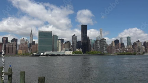 Viewing beautiful breathtaking Manhattan Skyline from Long Island City in New York, wide shot panorama with ONU,United Nations Headquarters,Ultra Hd 4k, real time