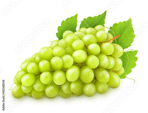 Green grape with leaves isolated on a white