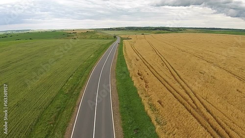 Aerial view of the sown fields near the motorway photo